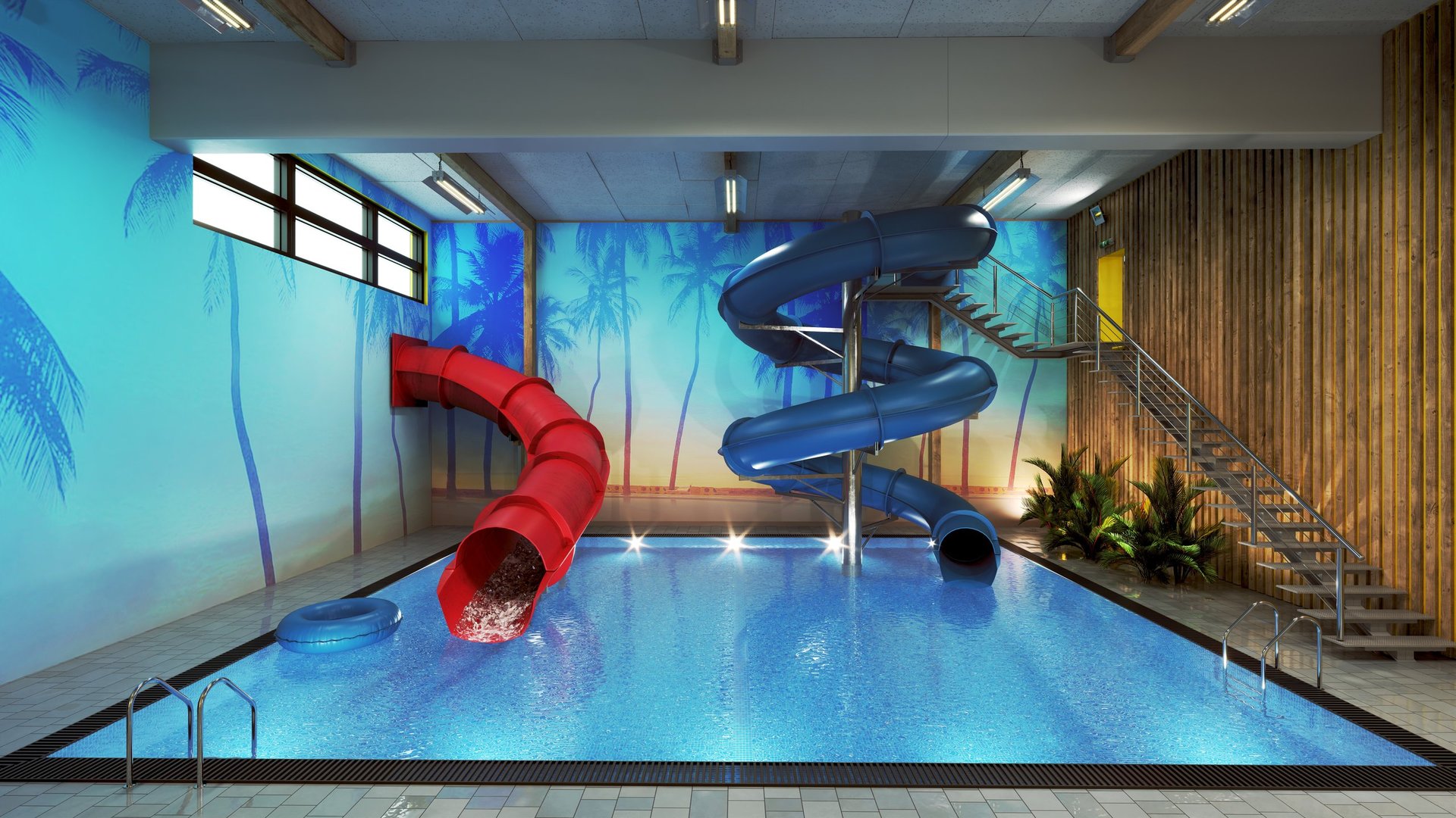 An indoor pool area featuring red and blue water slides and a tropical beach mural